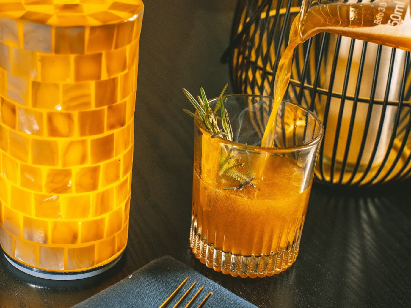 Orange cocktail, decorations on the side